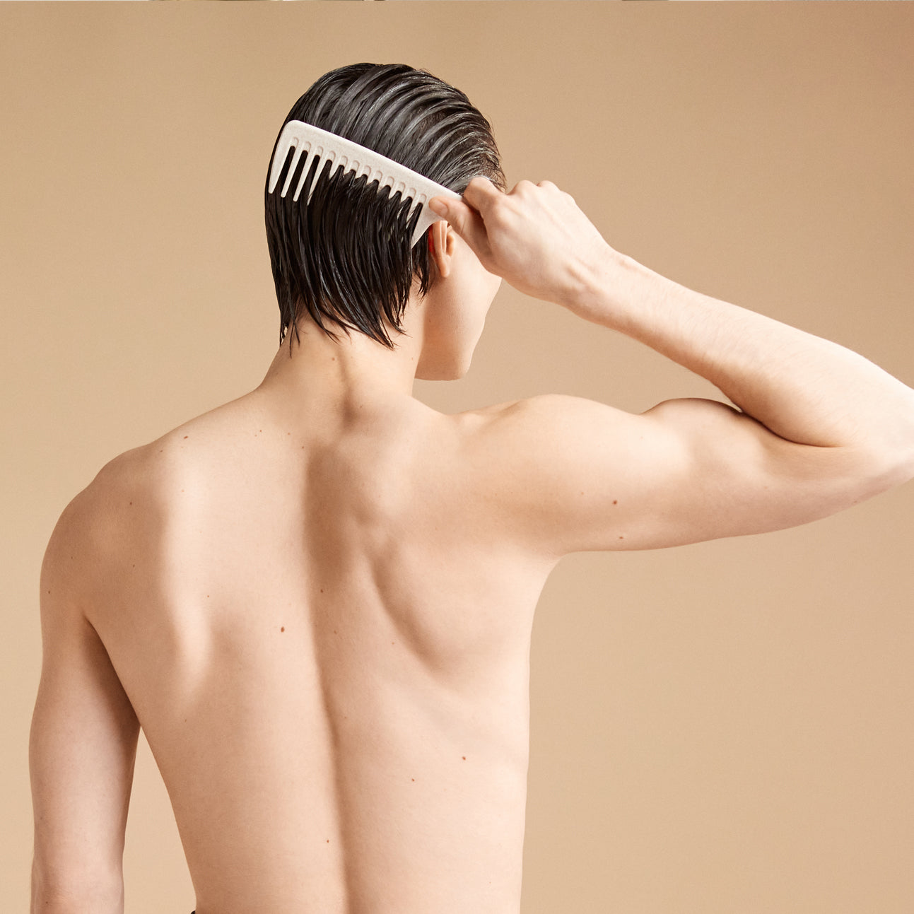 A shirtless toned man